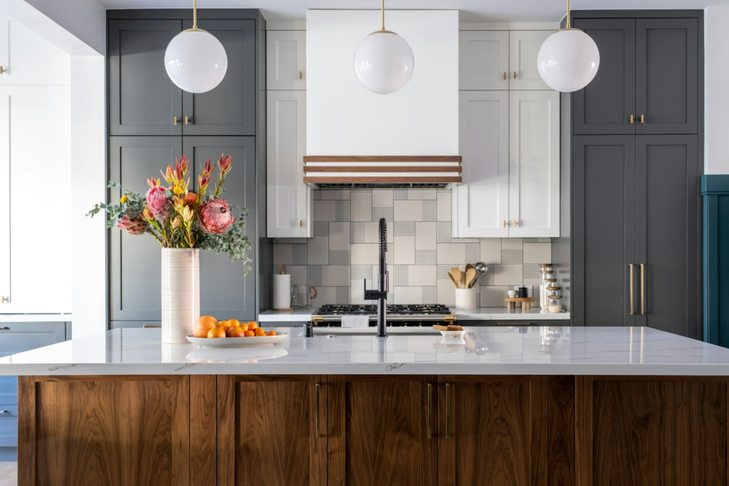 | Atlanta Granite Pros a kitchen with a natural stone counter top and wooden cabinets